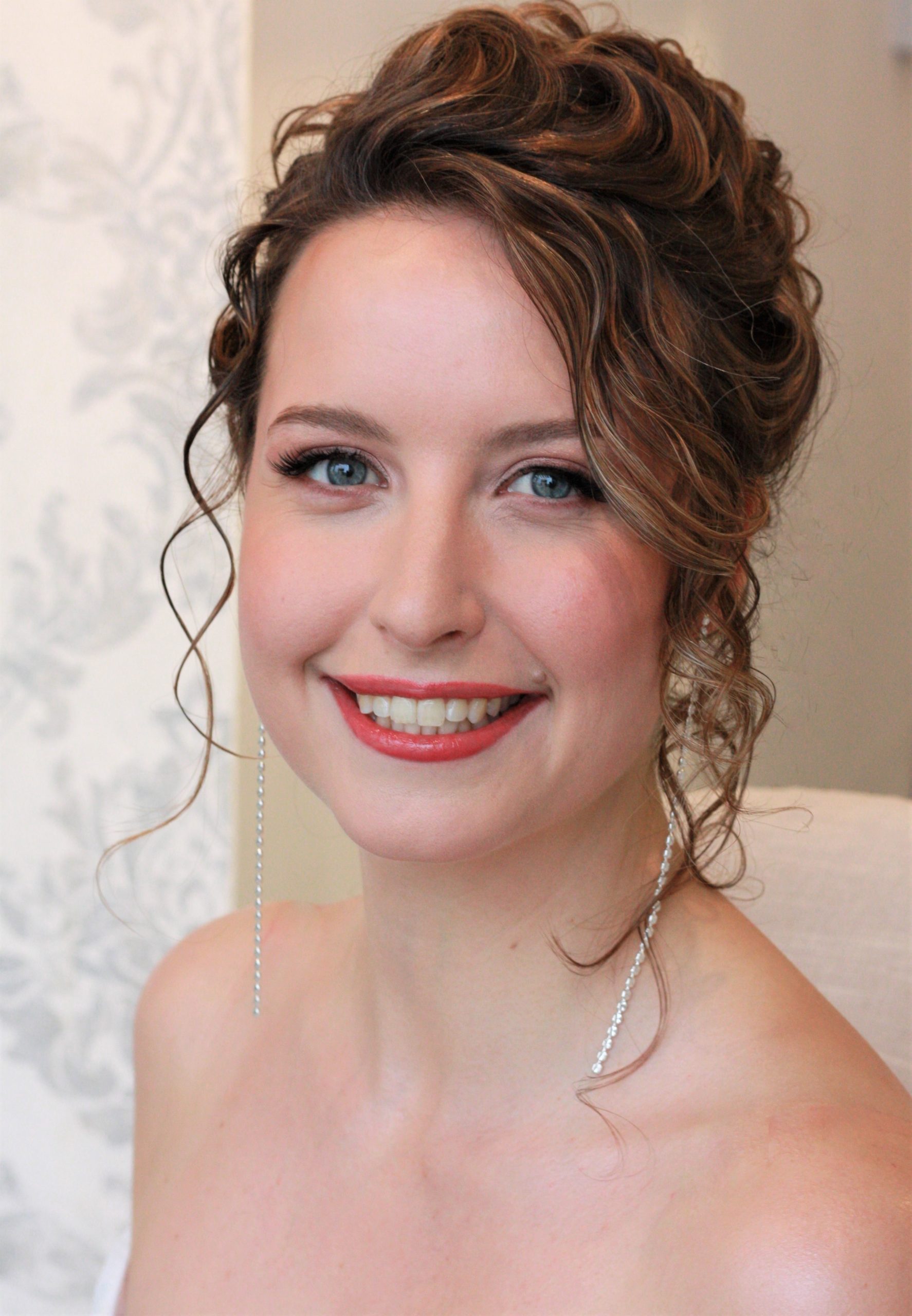 Bridal makeup and hairstyling with natural curls
